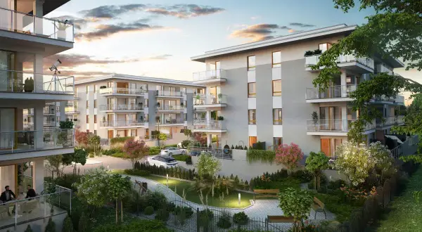 Nowoczesne mieszkania do wynajęcia Suwałki. Eleganckie apartamenty z balkonami, zielony dziedziniec, ławki, drzewa i krzewy.